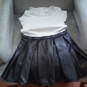 White Top and Black Pleated Skirt